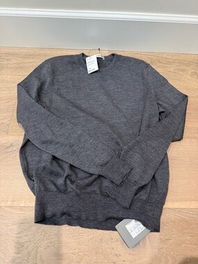 Brand new authentic Sweater in Charcoal Gray. Pls note small hole on sleeve.